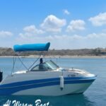 Private fishing and cruising boat in Abu Dhabi with modern seating and ocean background