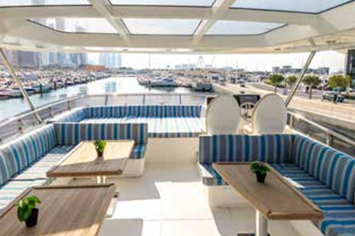Spacious upper deck of Caliente 96 FT yacht customized with premium catering and hospitality zones for 95 corporate guests.
