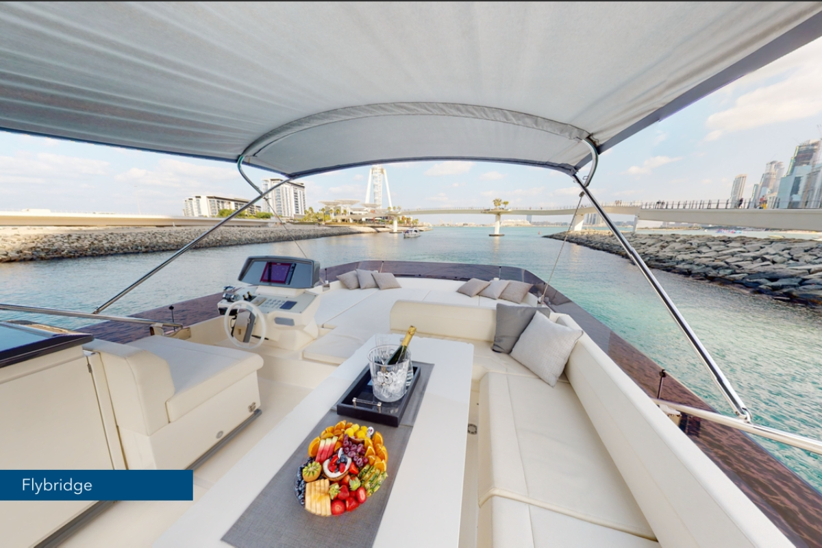 Sophisticated interior salon of the Ferretti 670 F1 trackside yacht charter featuring premium speakers.