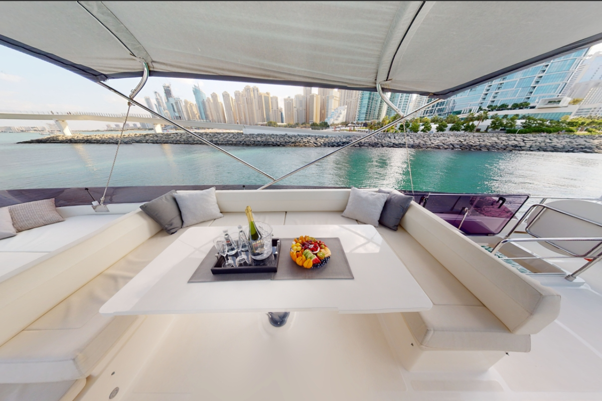Gourmet food catering and premium drinks hospitality onboard the Ferretti 670 F1 trackside yacht charter.