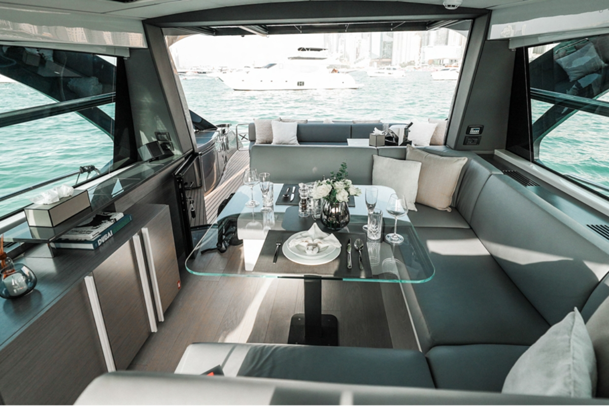 Sleek contemporary interior salon of the Pershing 5x yacht with premium sound speakers and luxury seating.