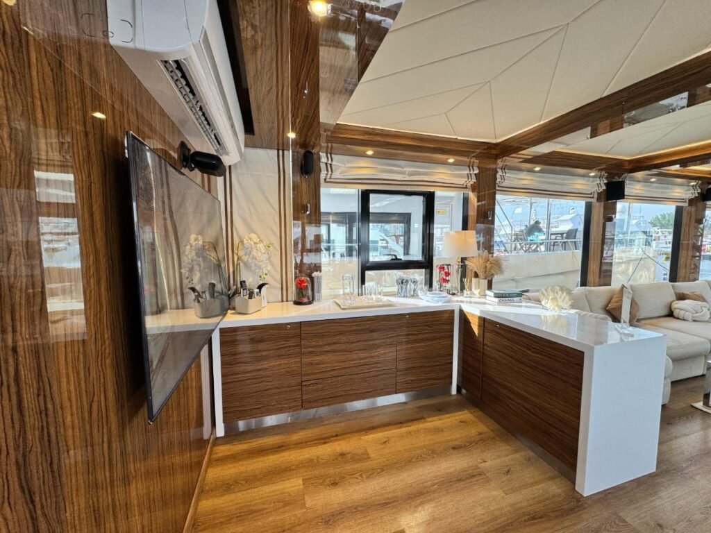 Amber Regent yacht rental walnut bar counter with TV, Yas Marina, Abu Dhabi