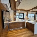 Amber Regent yacht rental walnut bar counter with TV, Yas Marina, Abu Dhabi