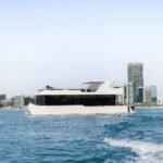 Amber Regent yacht rental cruising past the Abu Dhabi skyline, Yas Marina, Abu Dhabi