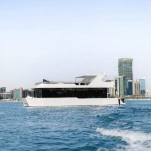 Amber Regent yacht rental cruising past the Abu Dhabi skyline, Yas Marina, Abu Dhabi