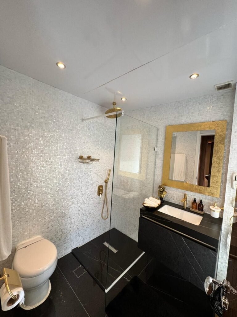 Amber Regent yacht rental bathroom with glass rain shower, Yas Marina, Abu Dhabi