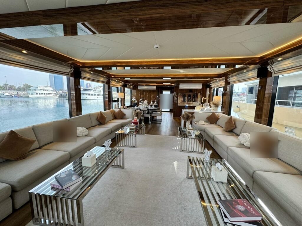 Amber Regent yacht rental walnut-panelled air-conditioned salon, Yas Marina, Abu Dhabi