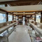 Amber Regent yacht rental walnut-panelled air-conditioned salon, Yas Marina, Abu Dhabi