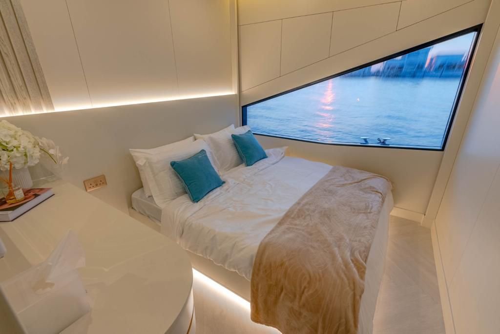 Celestia yacht rental cabin with double bed and panoramic window, Yas Marina, Abu Dhabi