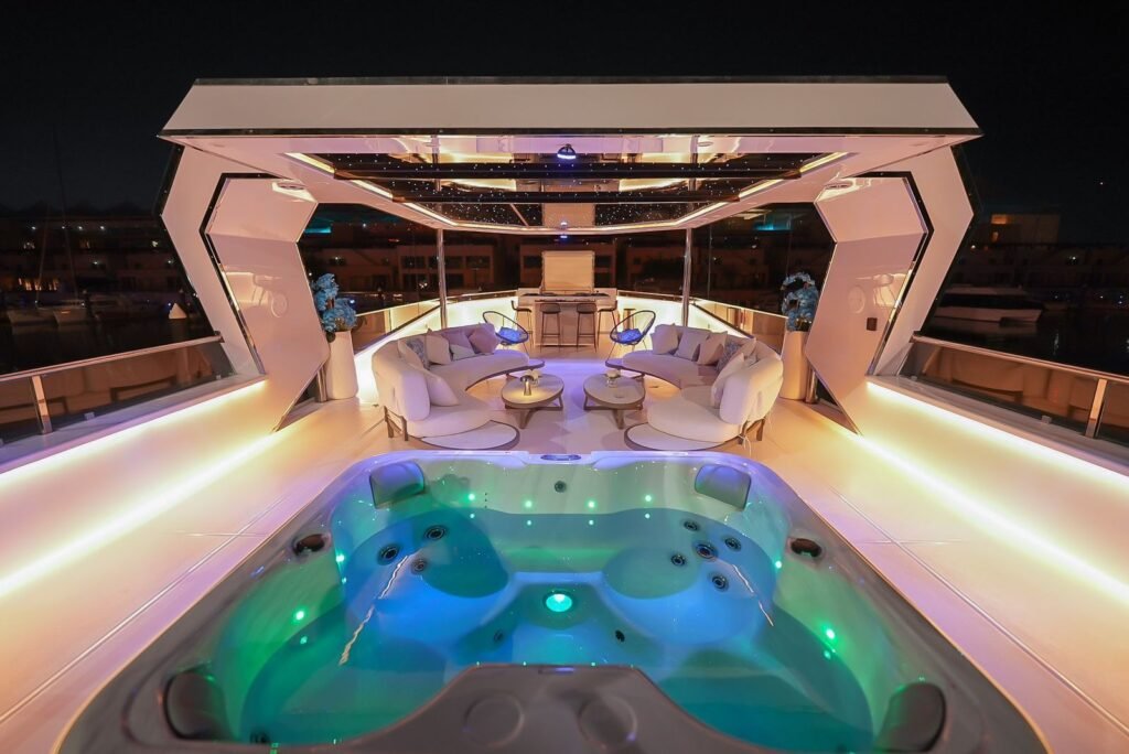 Celestia yacht rental jacuzzi glowing at night, Yas Marina, Abu Dhabi