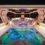 Celestia yacht rental jacuzzi glowing at night, Yas Marina, Abu Dhabi