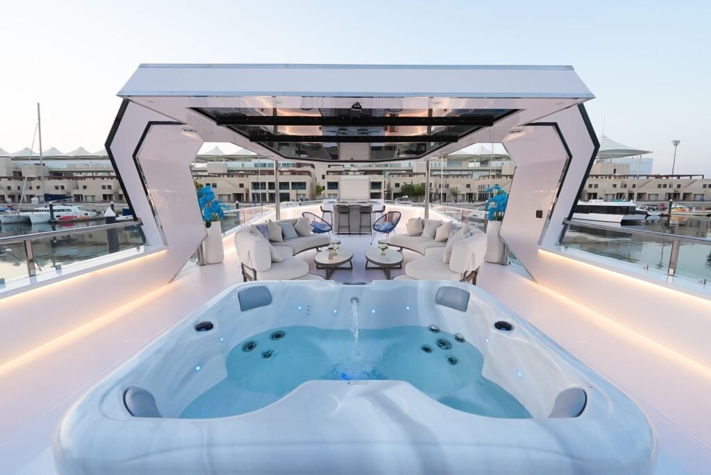 Celestia yacht rental jacuzzi and upper deck lounge by day, Yas Marina, Abu Dhabi