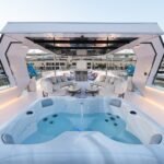 Celestia yacht rental jacuzzi and upper deck lounge by day, Yas Marina, Abu Dhabi
