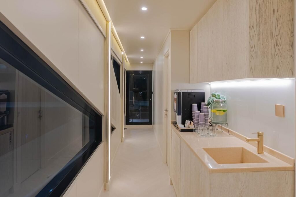 Celestia yacht rental light-wood corridor and drinks station, Yas Marina, Abu Dhabi