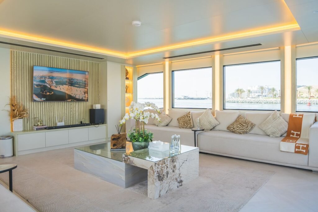 Celestia yacht rental salon sofas and TV wall, Yas Marina, Abu Dhabi