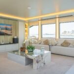 Celestia yacht rental salon sofas and TV wall, Yas Marina, Abu Dhabi