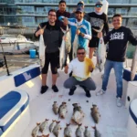 Group with the day's catch on Panda 1