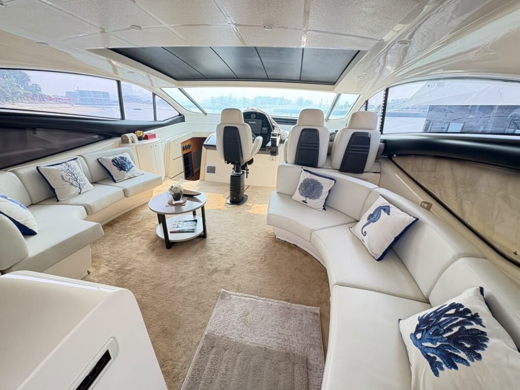 Pershing 62 main saloon with white sofas
